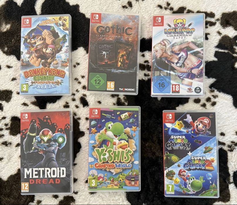 Nintendo Switch V2 incluindo 7 jogos + conta com vários jogos