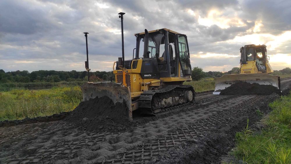 Usługi spycharką, koparką long