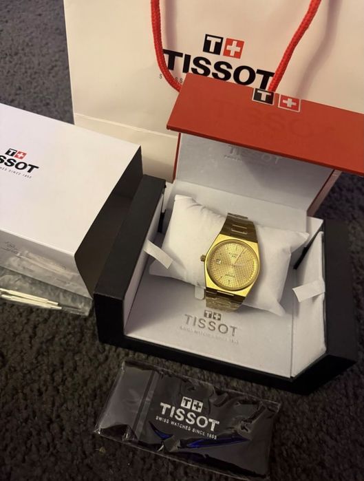 Relógio tissoft dourado