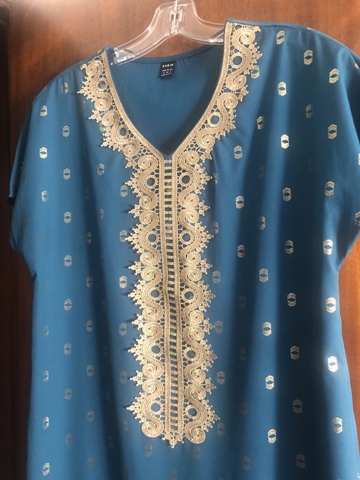 Uma  tunica nova varias pecas , e 1 vestidos novo ver fotos