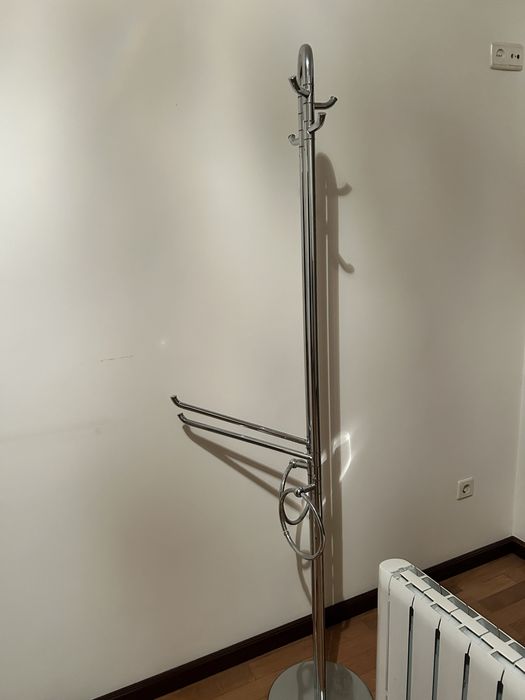 Chrome-plated coat hanger with adjustable arms