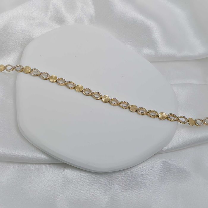 Złota bransoletka z motywem nieskończoności i cyrkoniami pr.585