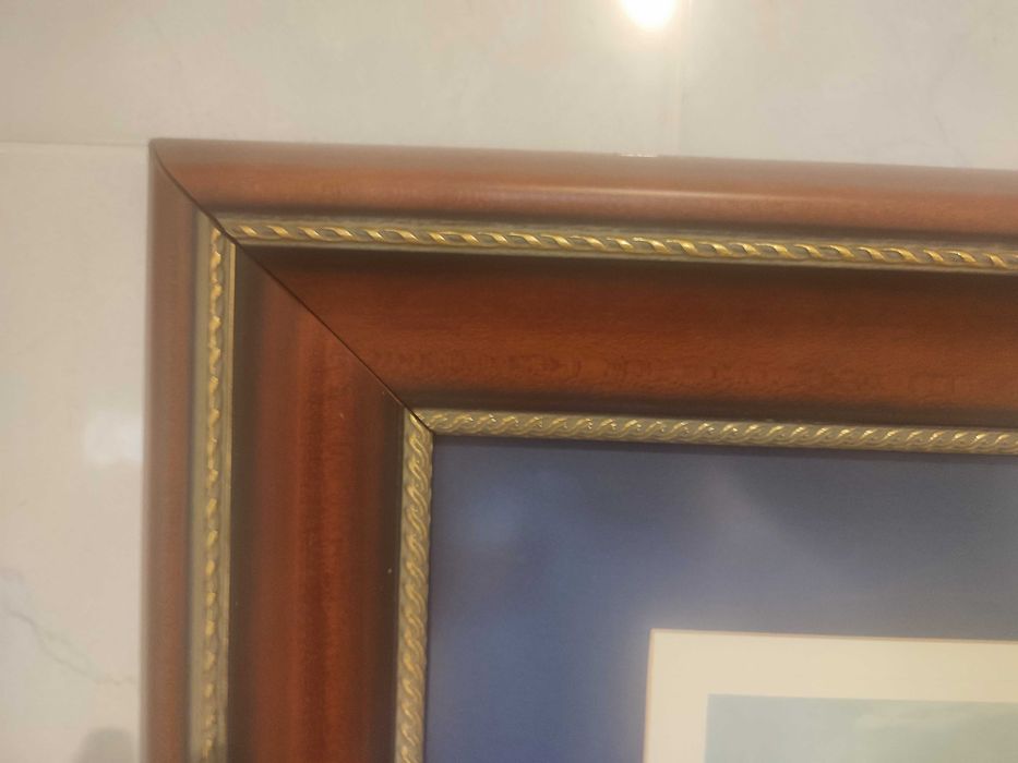 Quadro com passpartout azul e barcos