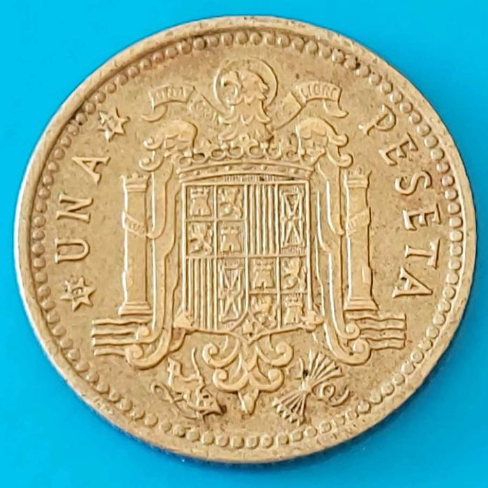 Una Peseta de 1966 com *73* na estrela, Espanha