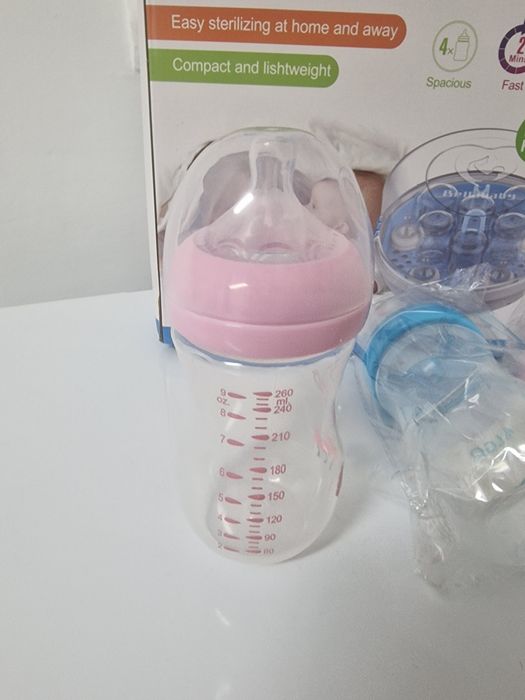 Esterilizador de biberons + 4 biberons