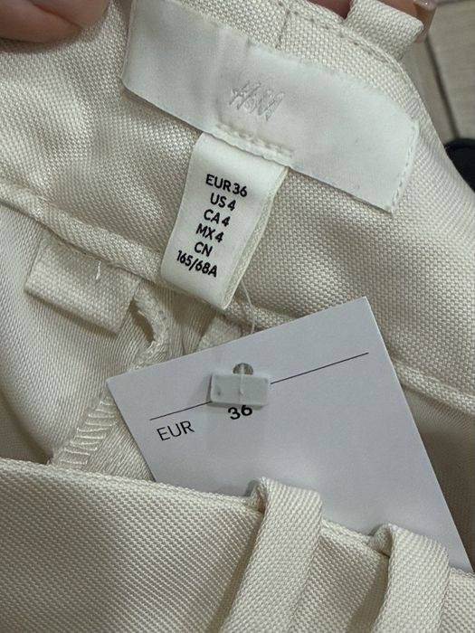 Нові широкі штани палаццо H&M зі стрілками (колір молочний)