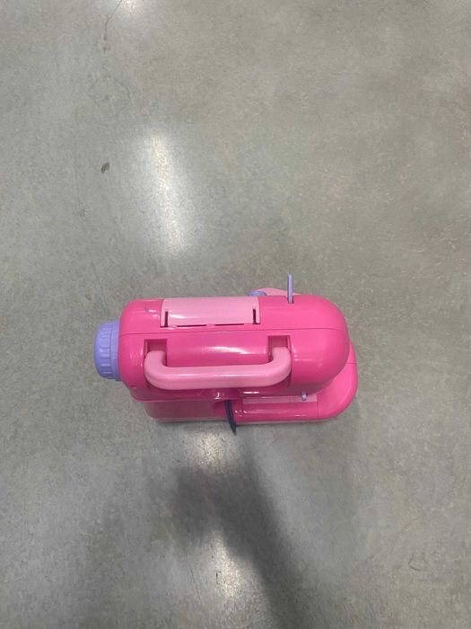 Maquina de costura de criança