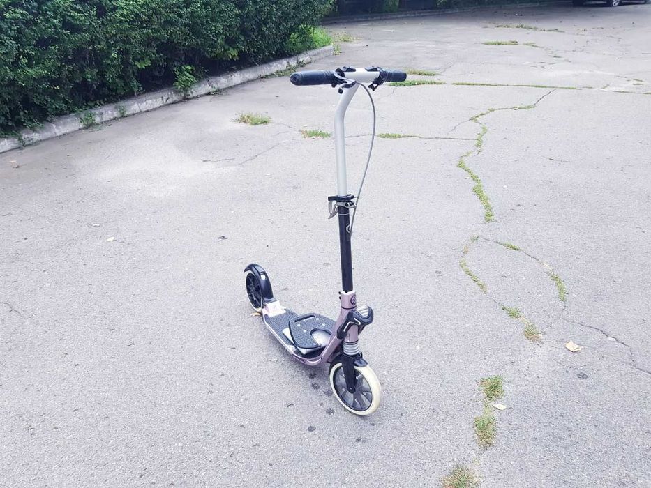Продам самокат Оxelo для дорослих (в стані нового)