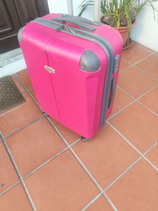 Blusão moto  em couro + 1 mala de viagem.