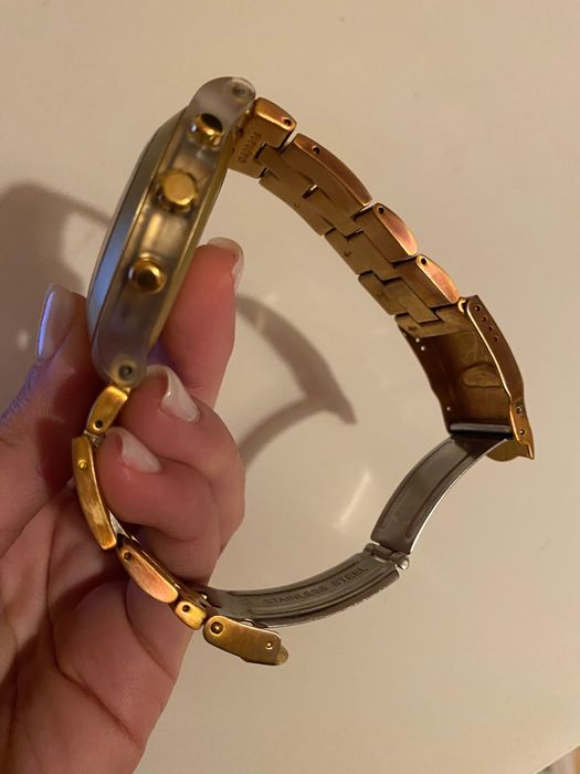 Relogio swatch dourado