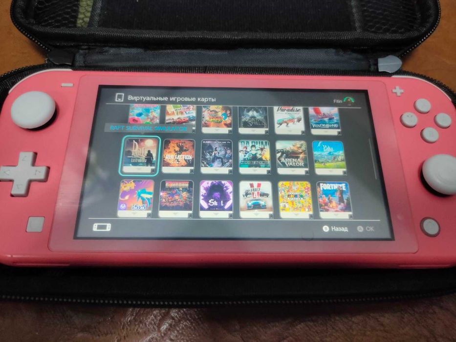 Nintendo Switch Lite та купа ігор плюс геймпад