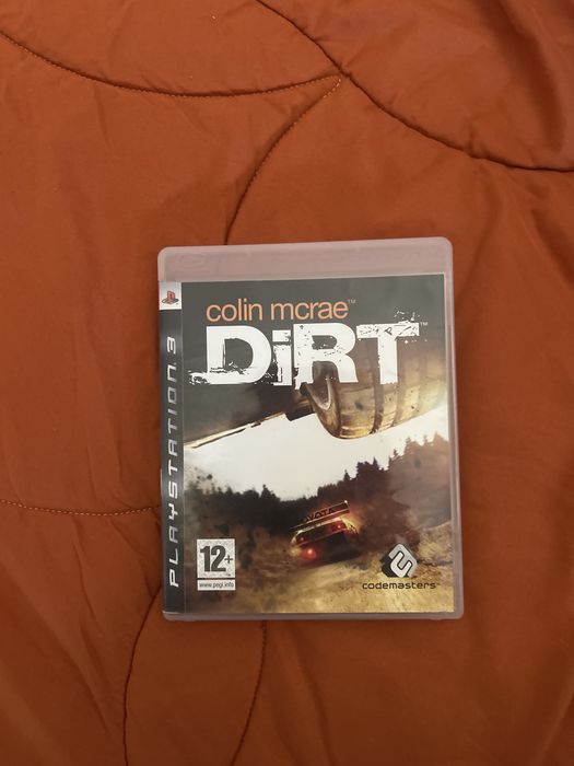 caixa com a capa e o manual do colin mcrae dirt