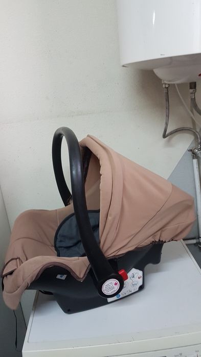 Maxicosi com redutor e toldo