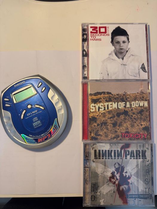 Discman + 3 cd.