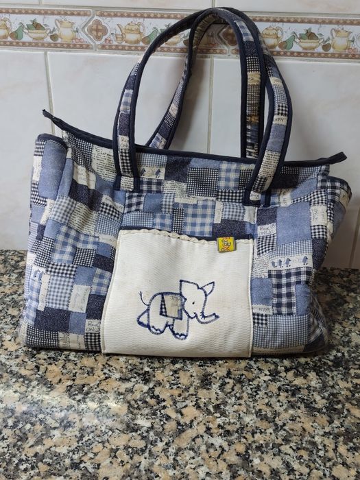Saco de bebê e cesta igual