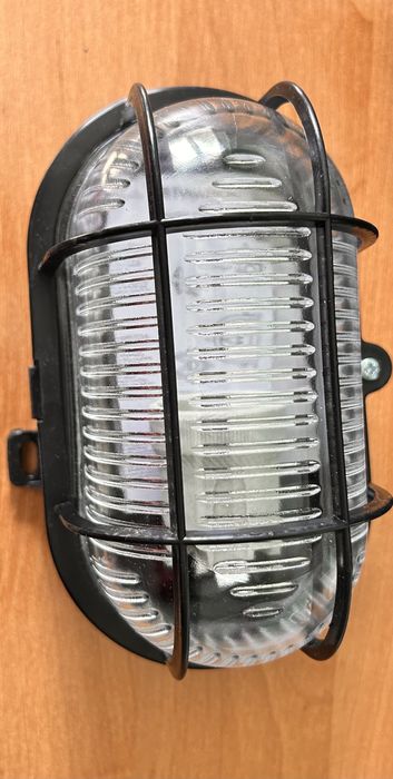 Oprawa kanałowa OWAL 60W E27 z siatką plastik IP44 czarna D.3151C