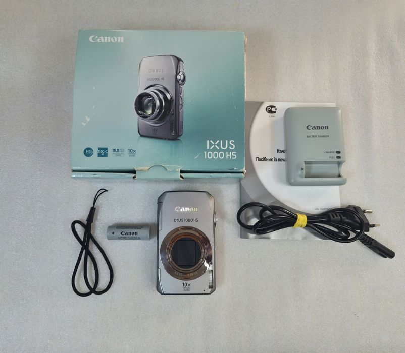 Цифровой фотоаппарат Canon IXUS 1000 HS с НЮАНСОМ
