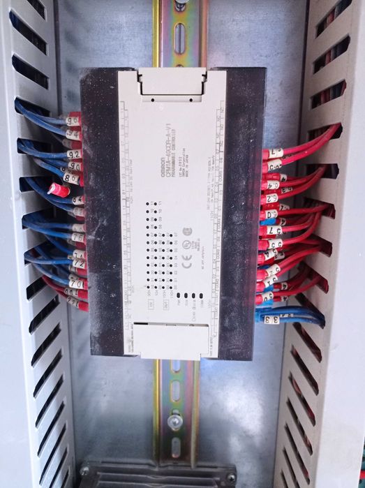 Metallic electrical cabinet with PLC and power supply.64751277340161121