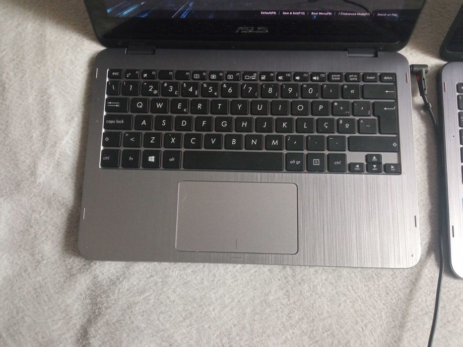 Two ASUS TP203N459820659691366402