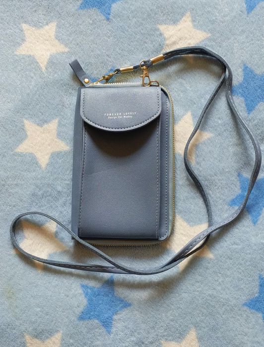 Mała niebieska torebka na telefon z portfelem