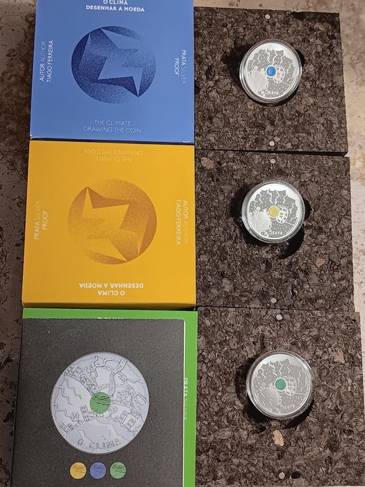 3 moedas prata prof de 5€ . O  Clima