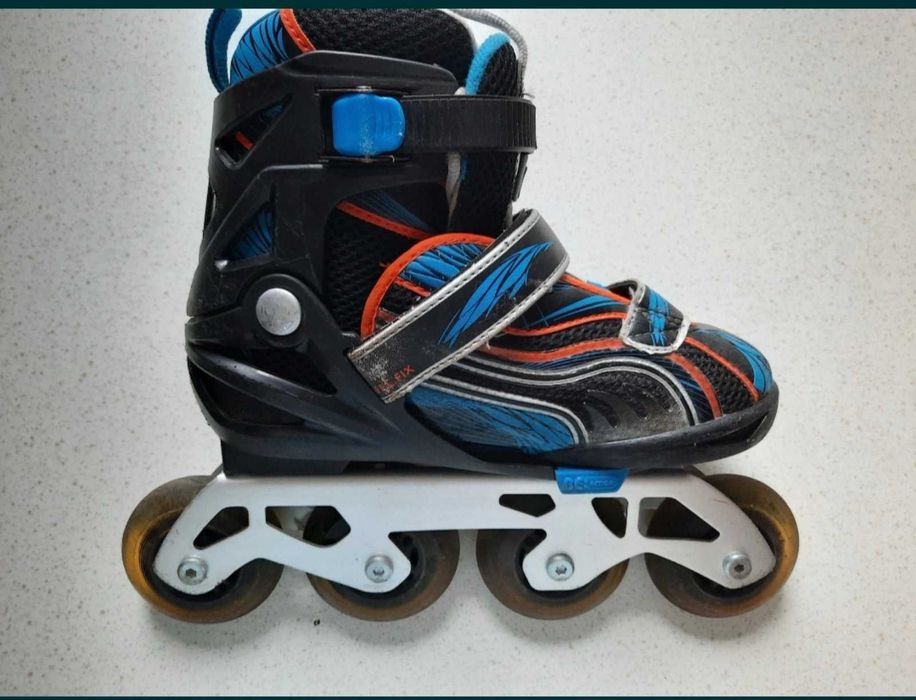 Роликовые коньки