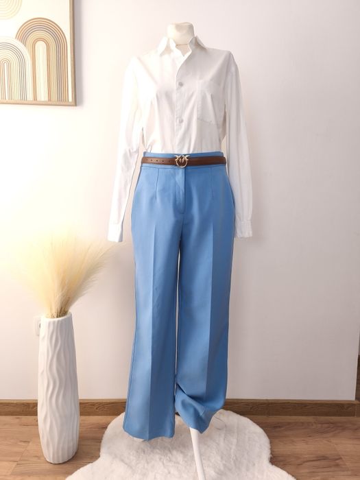 Błękitne eleganckie spodnie damskie rozmiar L w kant prosta nogawka