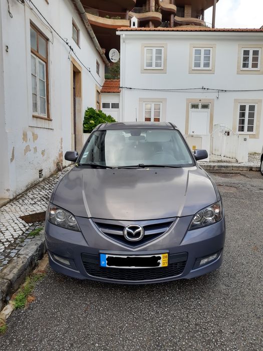 Faróis Ópticas Mazda 3 sedan 2008