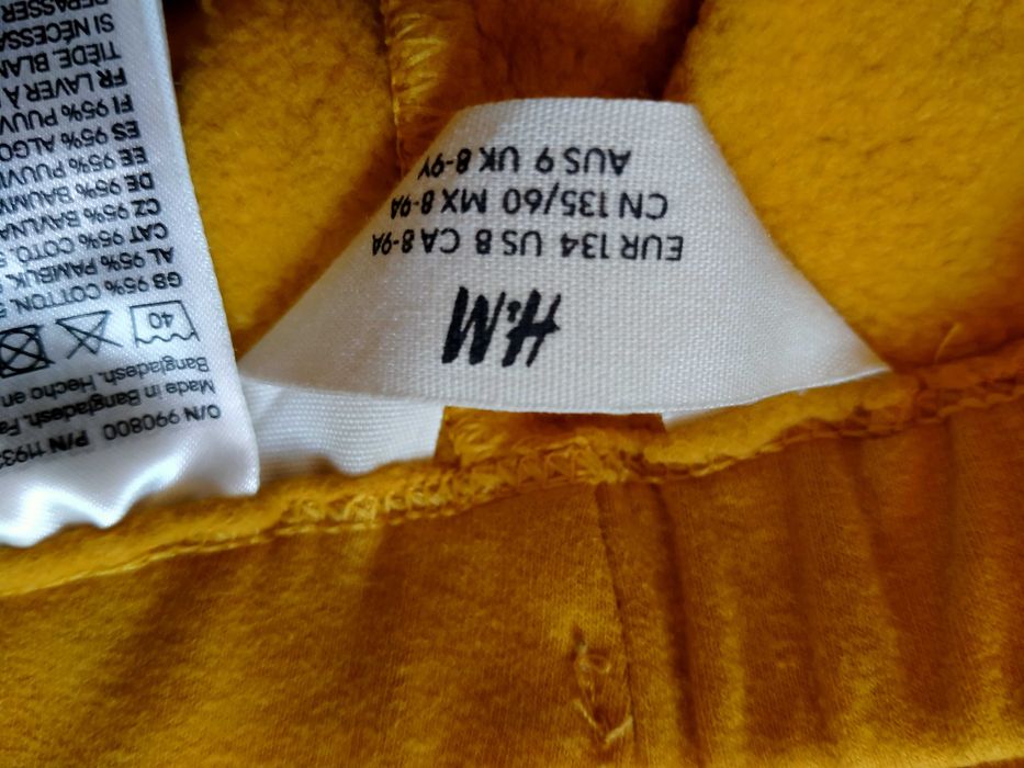 żółte spodnie z meszkiem 134 H&M