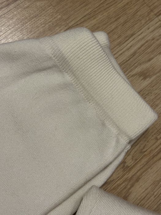 Трикотажний костюм молочного кольору з широкими брюками штанами