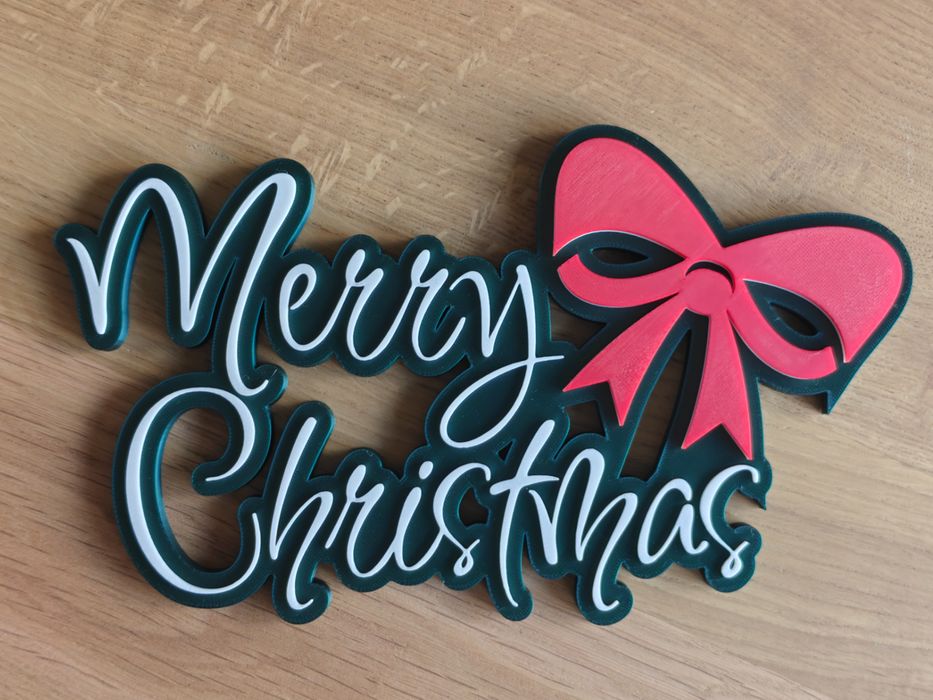 Sinal decorativo de Natal com letras e laço vermelho