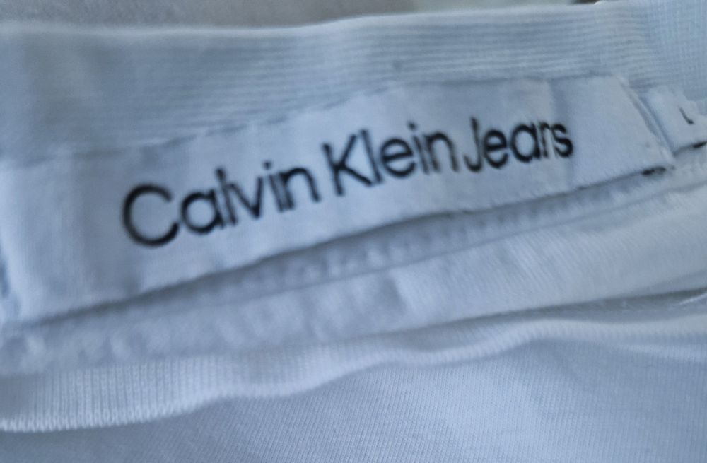 T- shirt bialy:Calvin Klein".