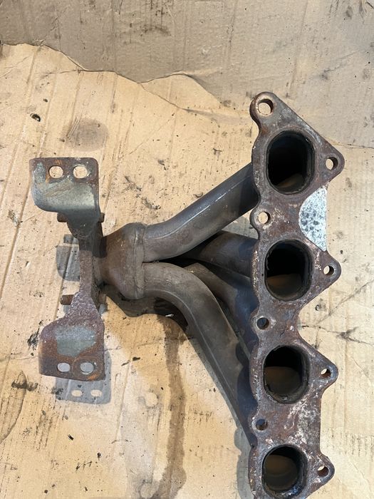 Випускний колектор MD310210 на 1.6, 1.8 Mitsubishi Carisma Lancer Colt