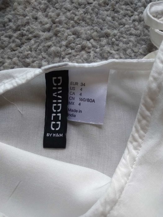 Biały top z falbaną H&M