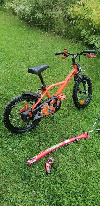 Rower Btwin pomarańczowy, hol rowerowy trail gator, kółka