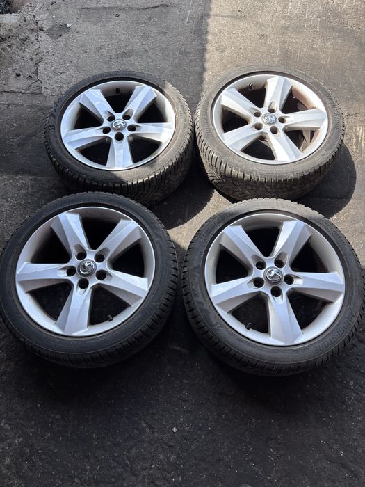 Opel Astra Meriva zafira  Vectra signum koła Felgi aluminiowe z oponami wielosezonowymi BRIDGESTONE 23 rok 6,5 mm 5x110 17 cali stan idealny