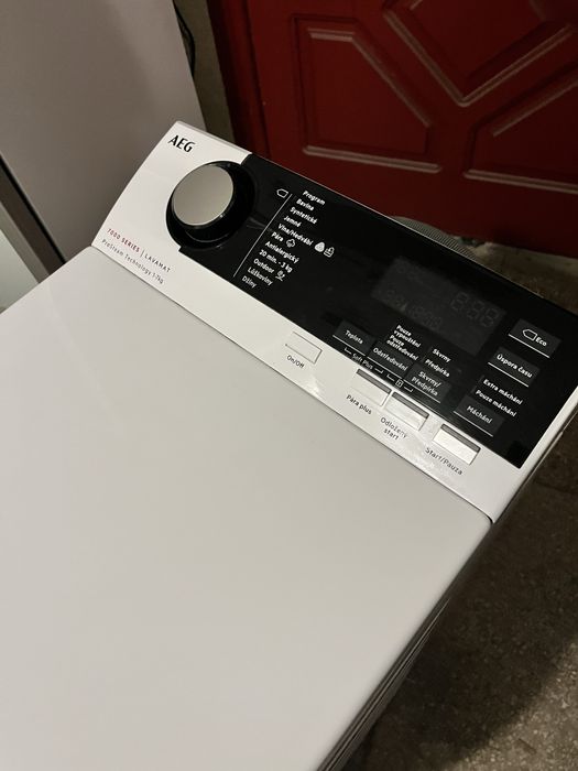 Вертикальна пральна машина AEG 7000 Series 1-7 кг