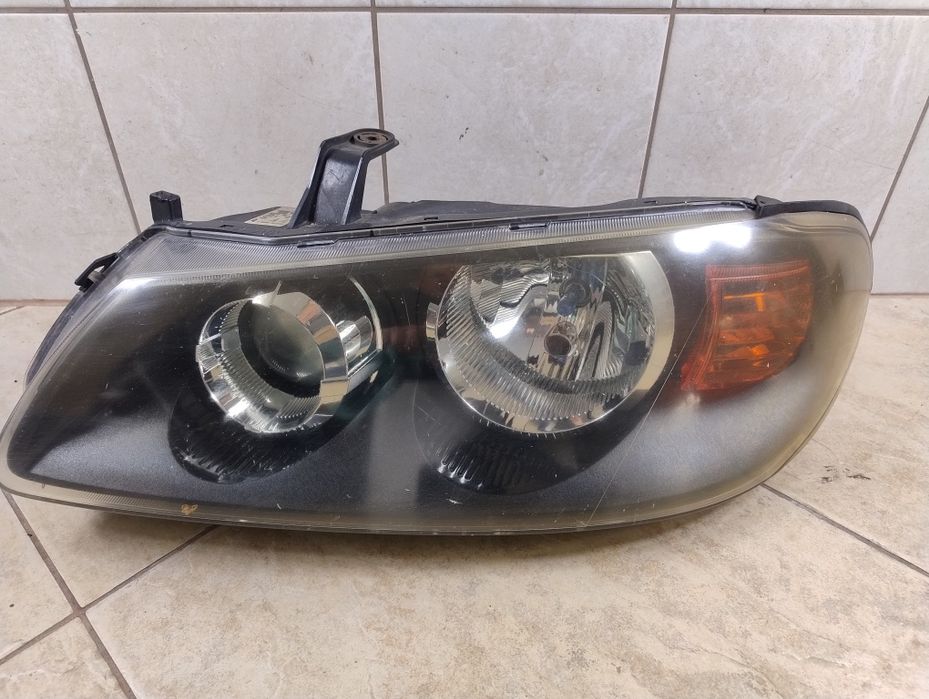 Lampa przód lewa Nissan Almera n16 lift oryginał wysyłka OLX Europa