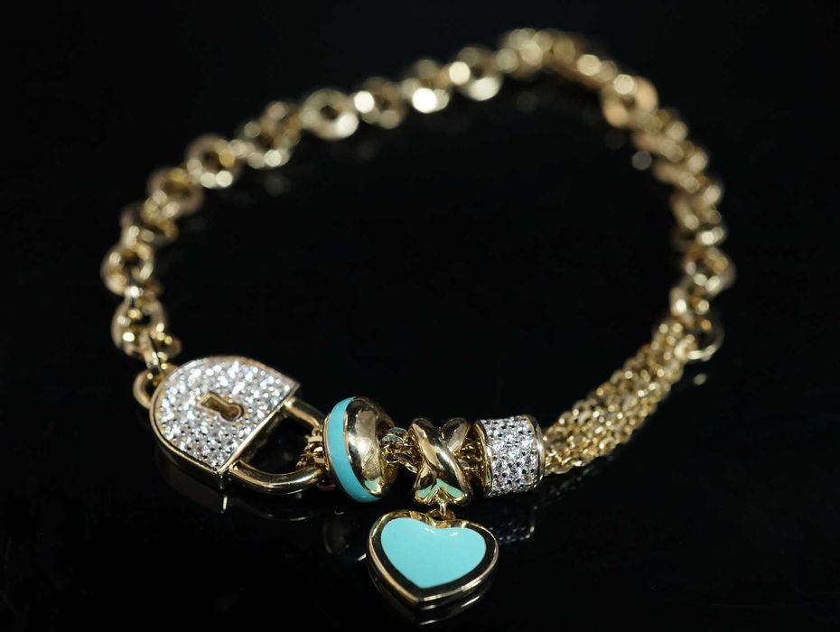 Złoto 585 - złota bransoletka z kłódką i serduszkiem.