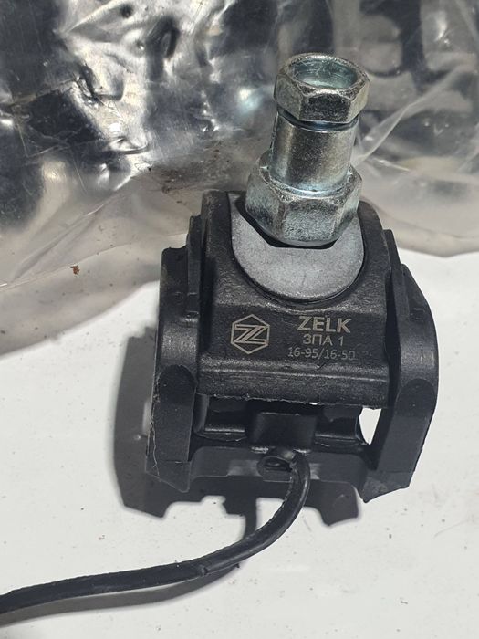 Затискач проколюючий