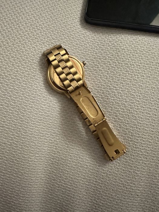Relogio Nixon dourado