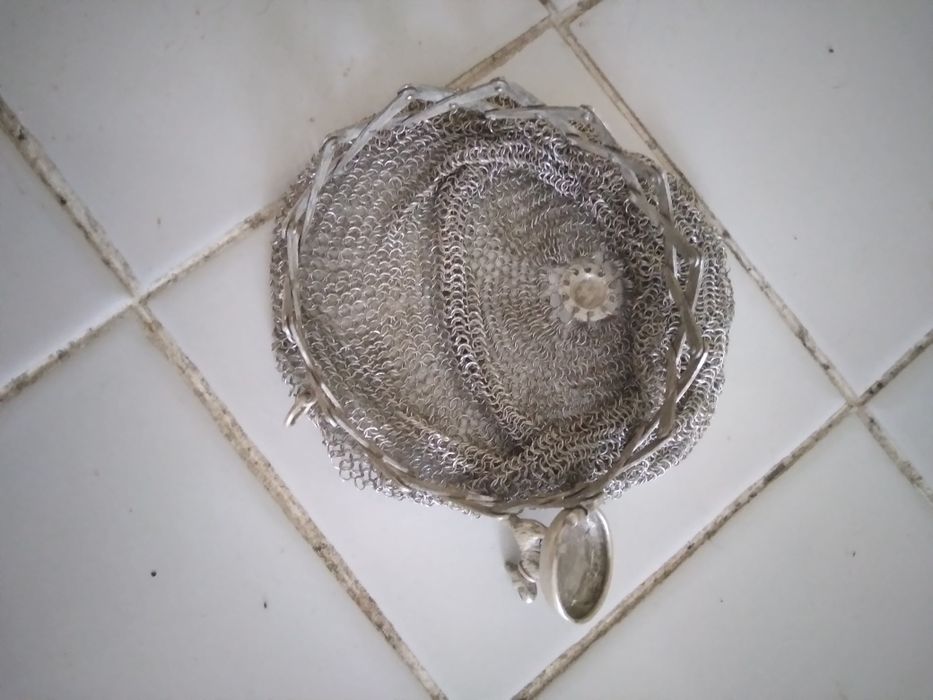 Porta moedas de prata.