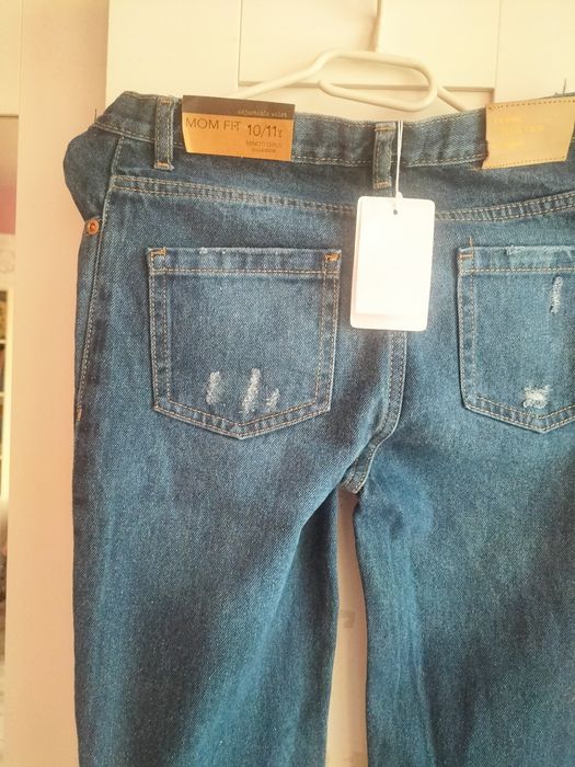 Nowe spodnie jeansowe 140/146