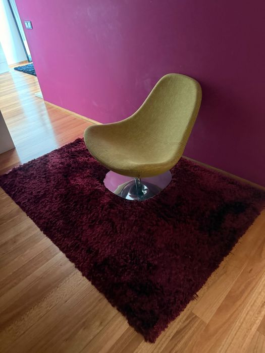 Poltrona verde rotativa