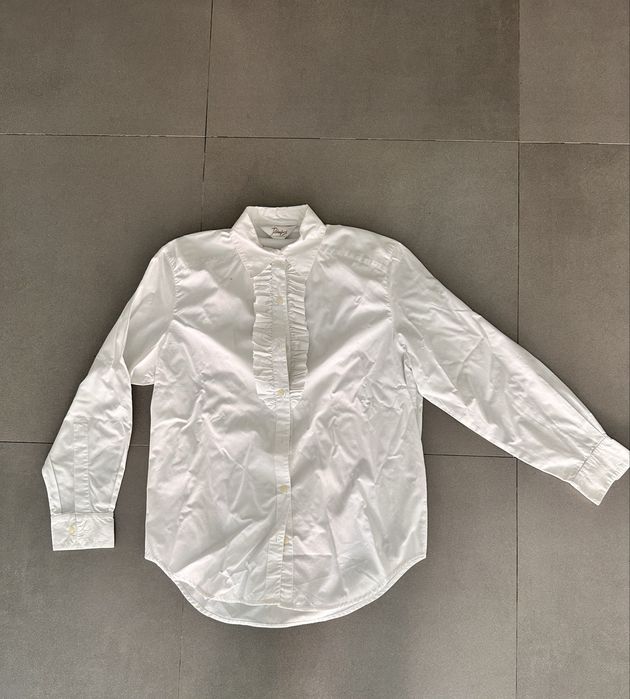 Camisa branca com folhos frente em estado novo