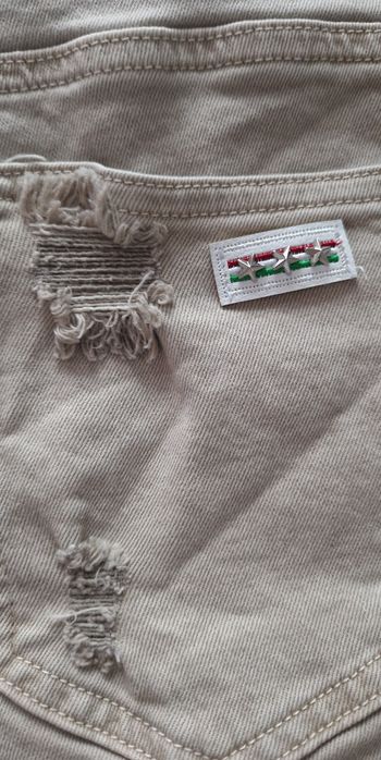 Proste beżowe jeansy z przetarciami spodnie jeansowe  By o la la XL