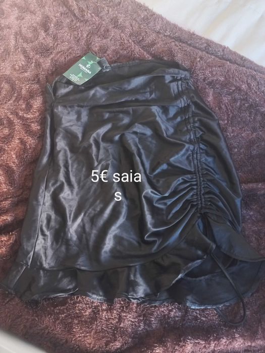 Roupa mulher e mala original  marca prada custa 1.200