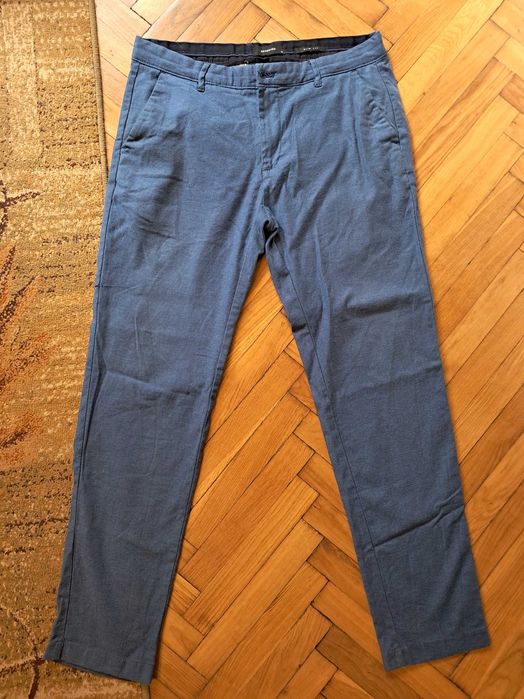 Spodnie meskie niebieskie, Reserved, slim, uszkodzone r. 34