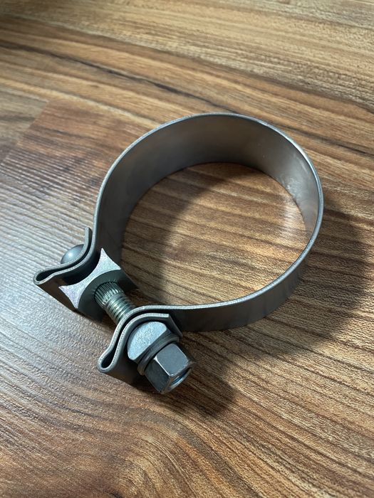 Новый алюминиевый хомут 75-80 мм.