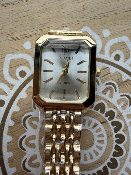 Relogio dourado senhora